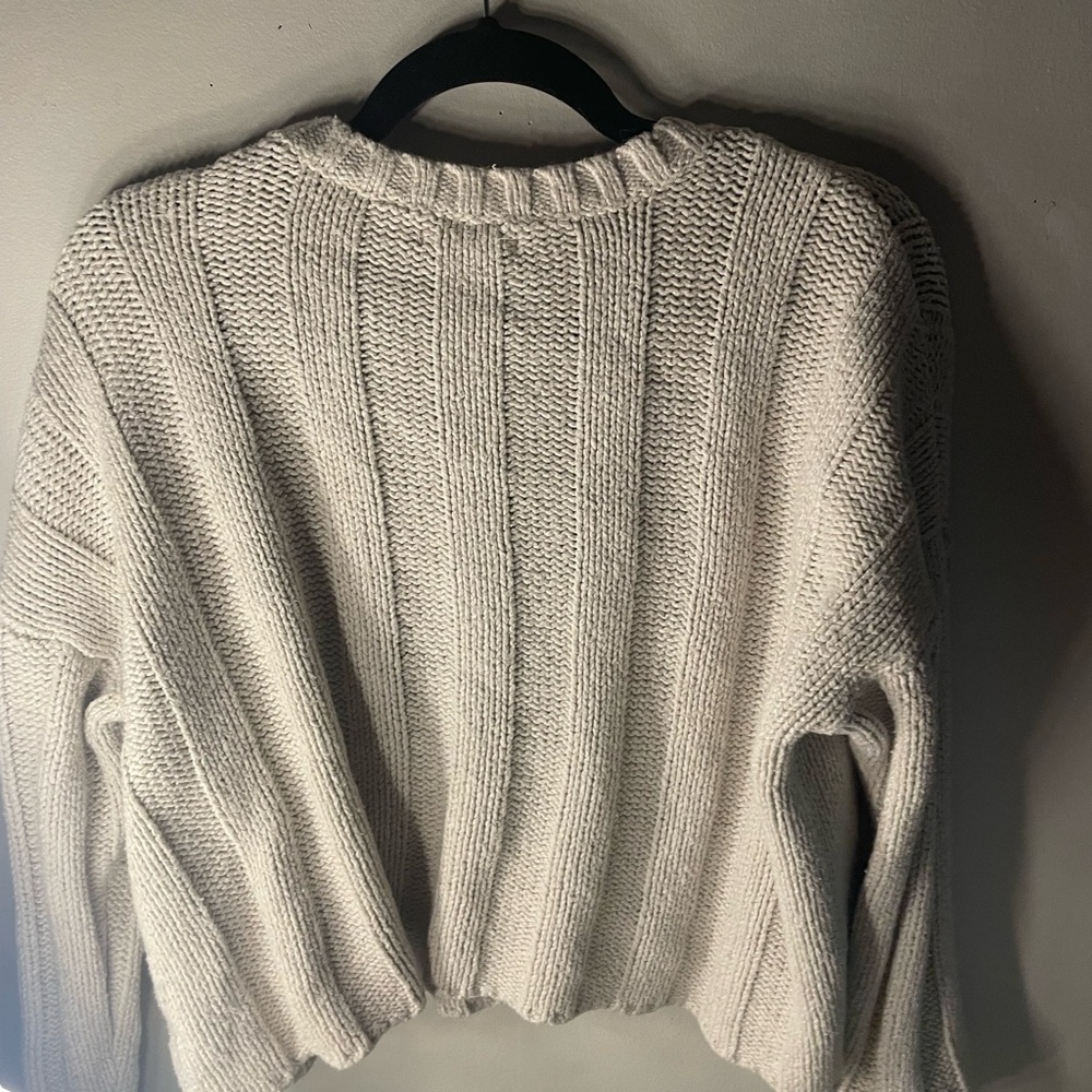 Cream sweater with cropped look